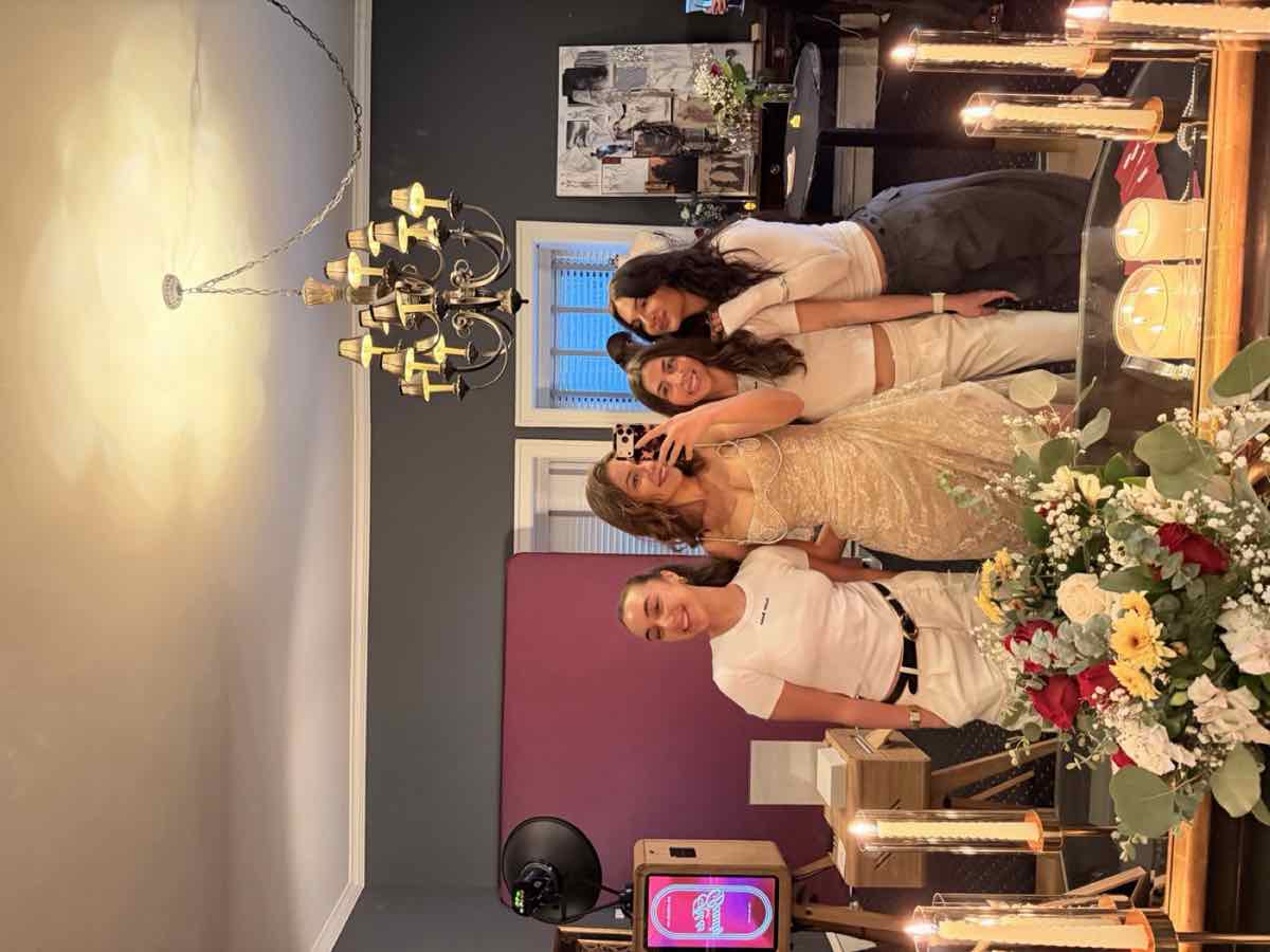 Guests posing together at the photo booth