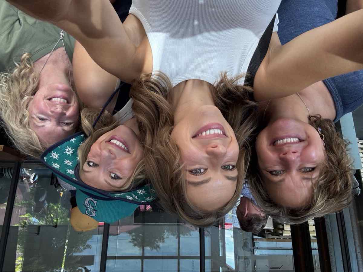 Taylor taking a sunny selfie with loved ones