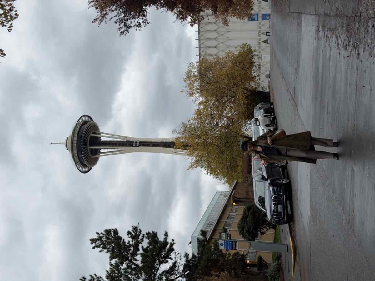 Taylor standing in front of the Space Needle on an autumn day